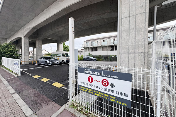 There is a hotel sign at the entrance.
